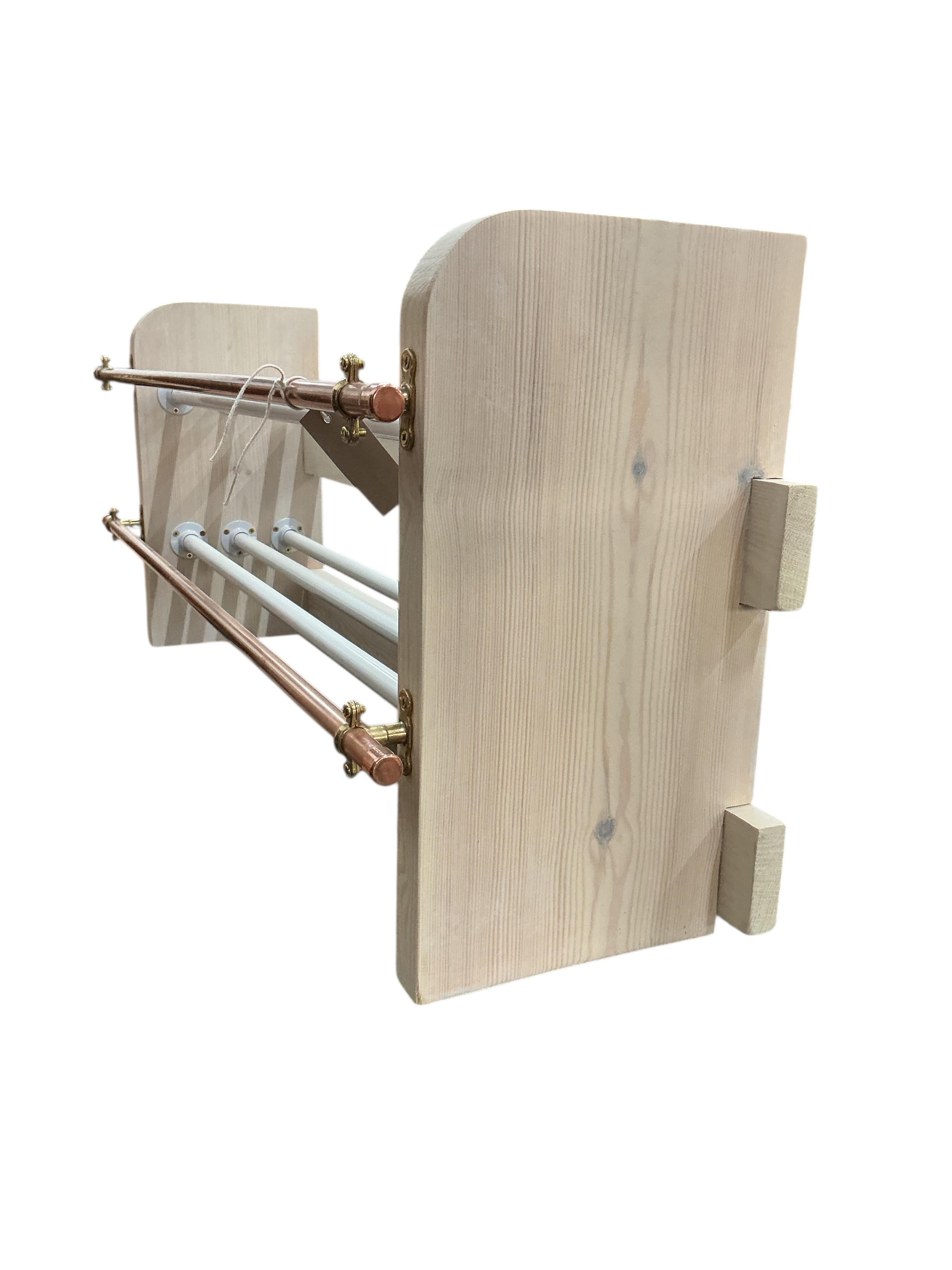 An industrial style painted wood and tubular copper shoe rack, width 93cm, depth 26cm, height 41cm